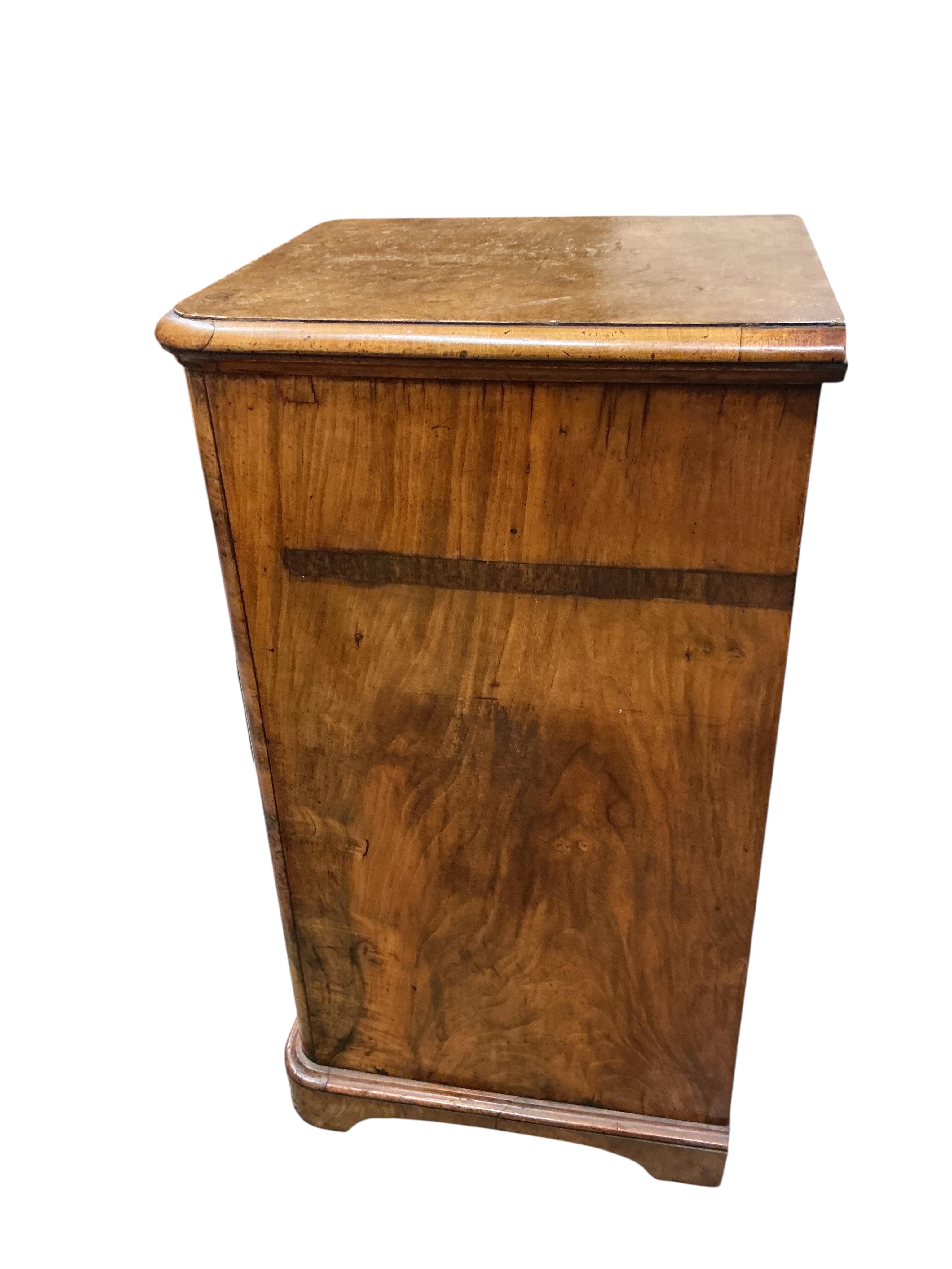 A pair of Victorian figured walnut five drawer bedside chests, adapted from a dressing table, width 43cm, depth 47cm, height 86cm